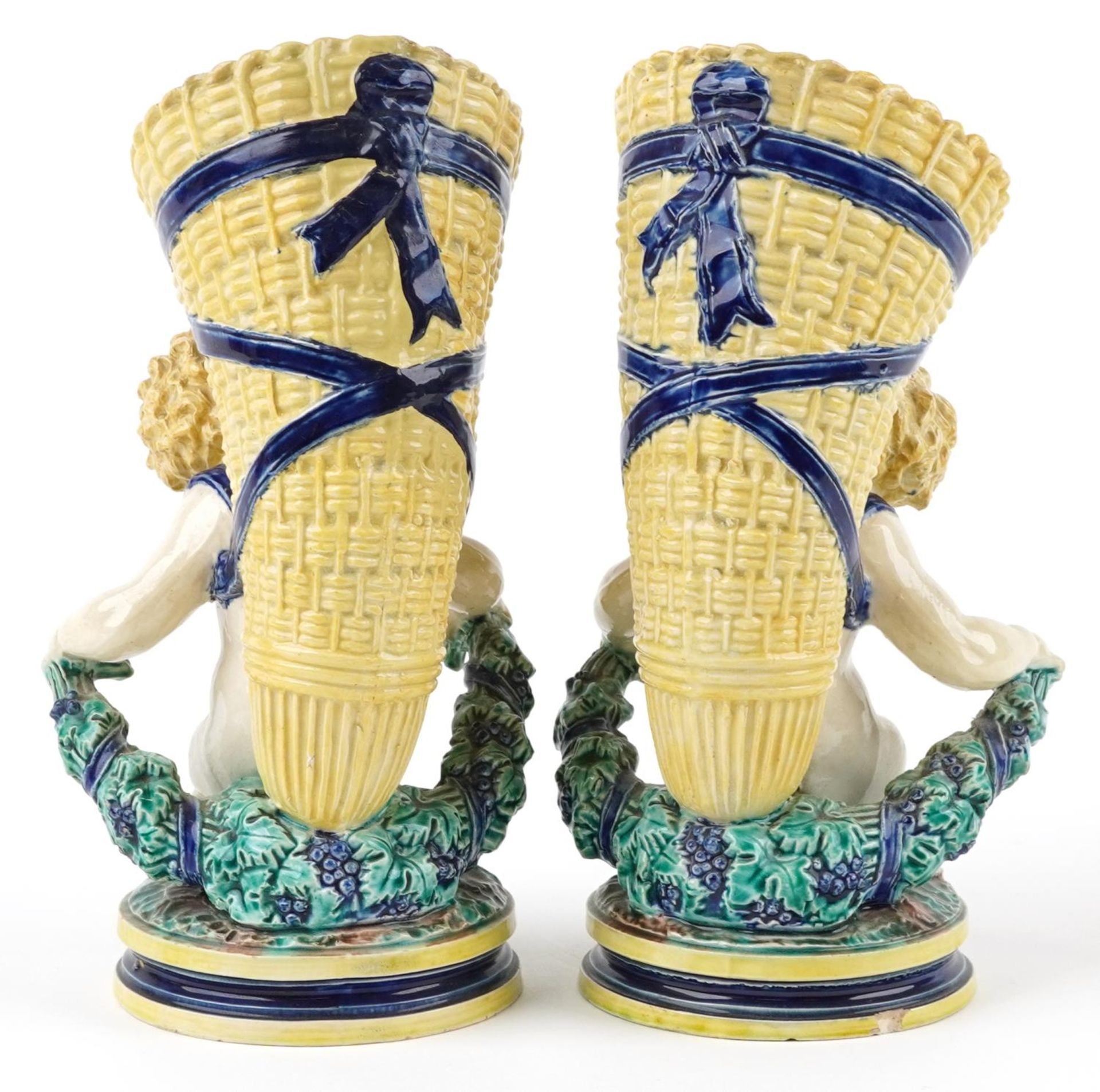 Pair of 19th century European Maiolica vases in the form of Putti carrying cornucopia, each with - Image 2 of 4