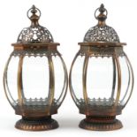 Pair of bronzed hanging lanterns with glass panels, 50cm high