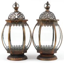 Pair of bronzed hanging lanterns with glass panels, 50cm high