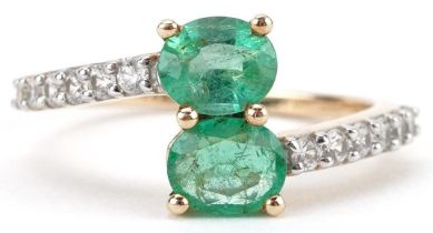 10ct gold emerald and white spinel crossover ring, size N/O, 2.2g