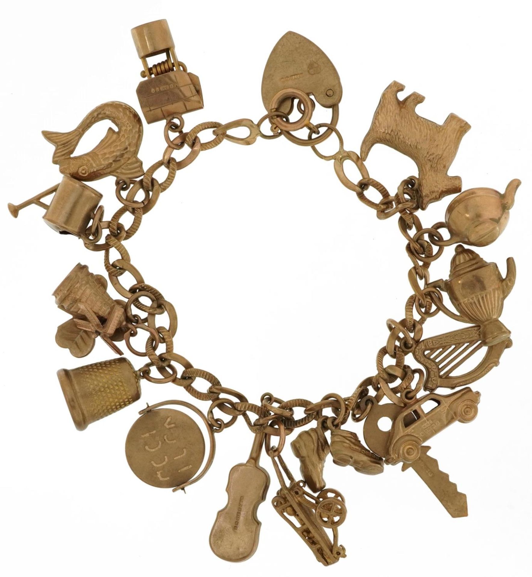 9ct gold charm bracelet with a collection of mostly 9ct gold charms including Good Luck spinner, - Image 2 of 3