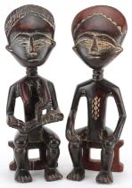 Pair of African tribal interest carved hardwood fertility figures, possibly from Ghana, 32.5cm high