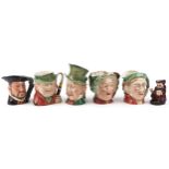 Six Beswick and Doulton character jugs including Scrooge and Henry VIII, the largest 23cm high