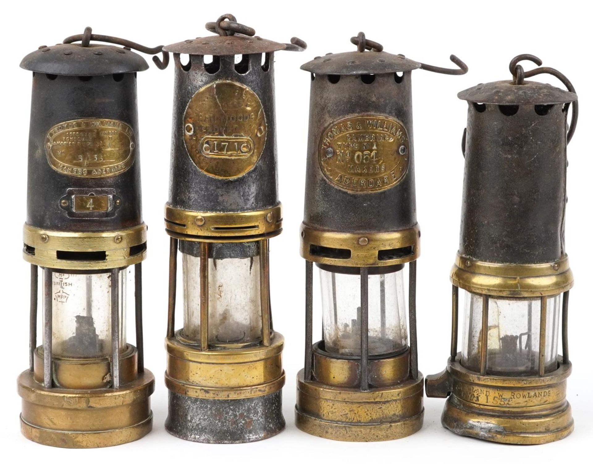 Four early 19th/early 20th century miner's lamps including two by Thomas & Williams, one impressed