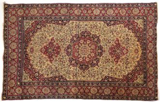 Rectangular Persian red ground rug having and allover repeat floral design, 227cm x 141cm