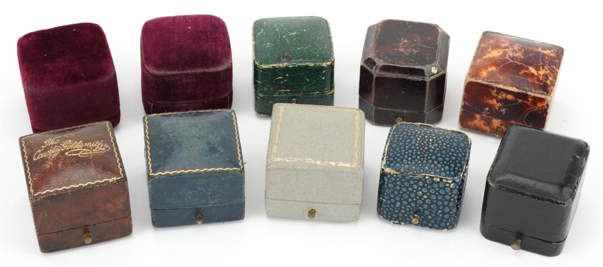 Ten 19th century and later jeweller's ring boxes with velvet and silk lined interiors including F