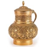 Turkish Ottoman Tombak lidded water jug with animalia handle decorated in relief with stylised