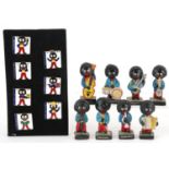 Set of eight Robertson's hand painted band figures and seven days of the week enamelled pin badges