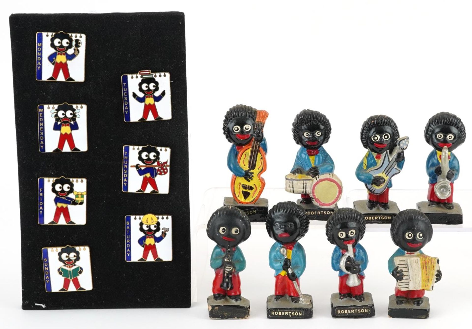 Set of eight Robertson's hand painted band figures and seven days of the week enamelled pin badges