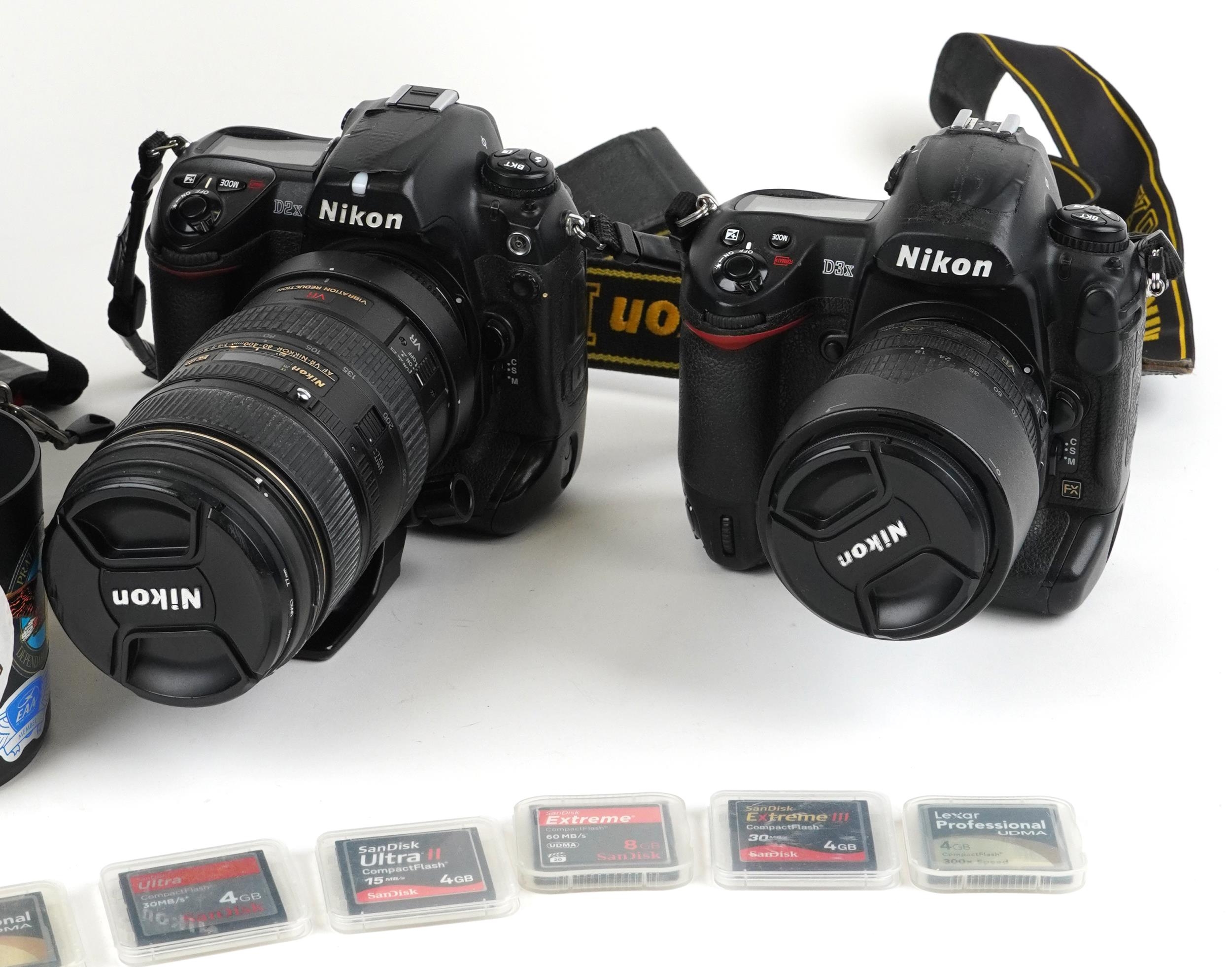 Two Nikon cameras with accessories comprising Nikon D3X with 80-105mm DX lens and Nikon D2X with - Image 3 of 5
