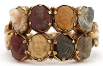19th century Grand Tour unmarked gold ring set with eight lava cameos carved with classical busts,