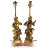 Pair of classical gilt painted, brass and onyx table lamps, each in the form of musicians seated