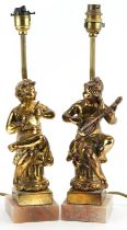 Pair of classical gilt painted, brass and onyx table lamps, each in the form of musicians seated