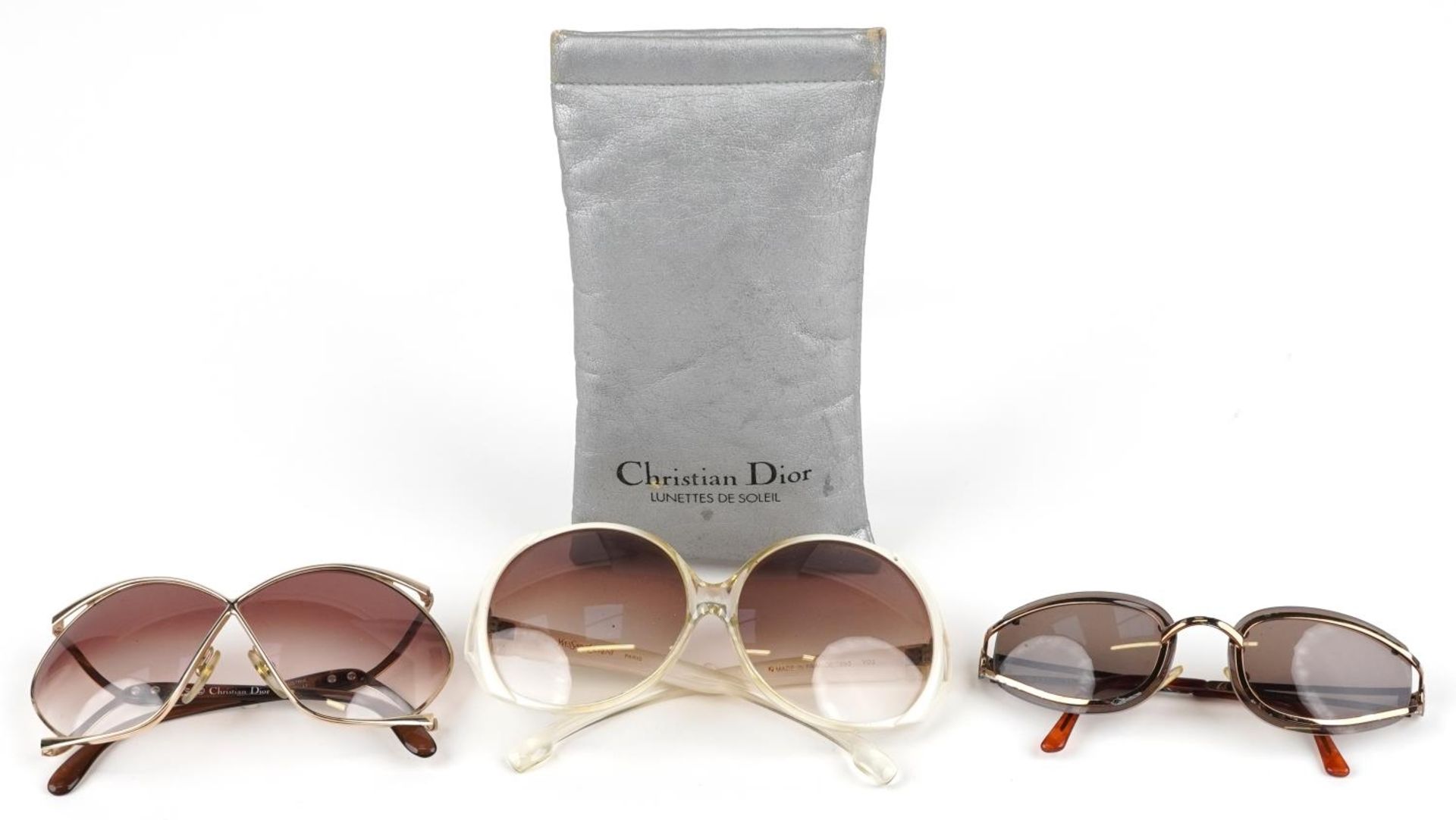 Three pairs of ladies sunglasses, comprising two Christian Dior, one with case and Yves Saint