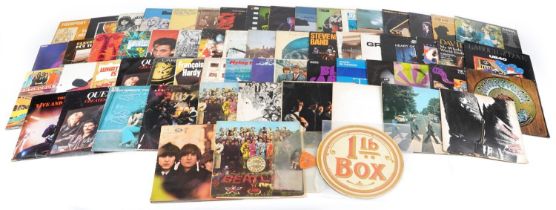 Vinyl LP records including The Beatles White Album, The Rolling Stones, Budgie, Black Sabbath, The