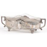 German Art Nouveau 800 grade silver centre bowl having twin handles and cut glass liner, embossed