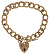 9ct gold engraved curb link charm bracelet with 9ct gold love heart padlock, 20cm in length, 40.0g