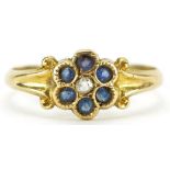 18ct gold diamond and sapphire flower head ring with scrolled shoulders, size N/O, 2.1g