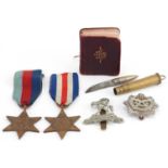 British militaria comprising two World War II medals, trench art bullet knife, Gurkha Transport