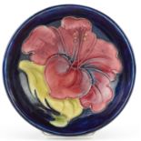 Moorcroft footed bowl hand painted in the hibiscus pattern, 11.5cm in diameter