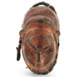 African tribal interest lacquered carved hardwood face mask, 28cm high