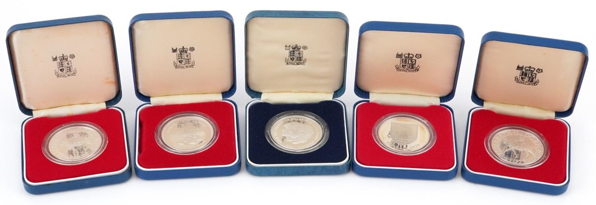 Five 1977 silver proof commemorative crowns by The Royal Mint with fitted cases