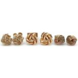 Three pairs of 9ct gold knot design stud earrings, the largest 6.5mm in diameter, total 2.5g