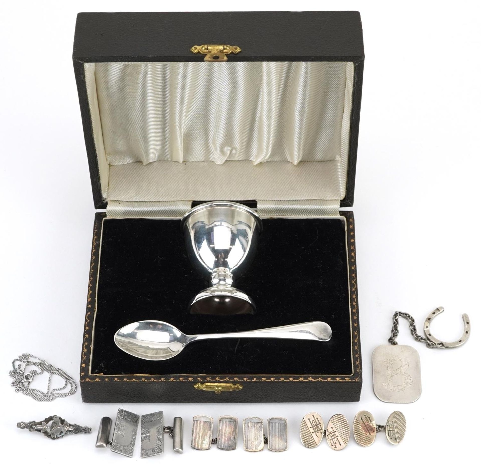 Victorian and later silver and white metal jewellery and a silver christening eggcup and spoon