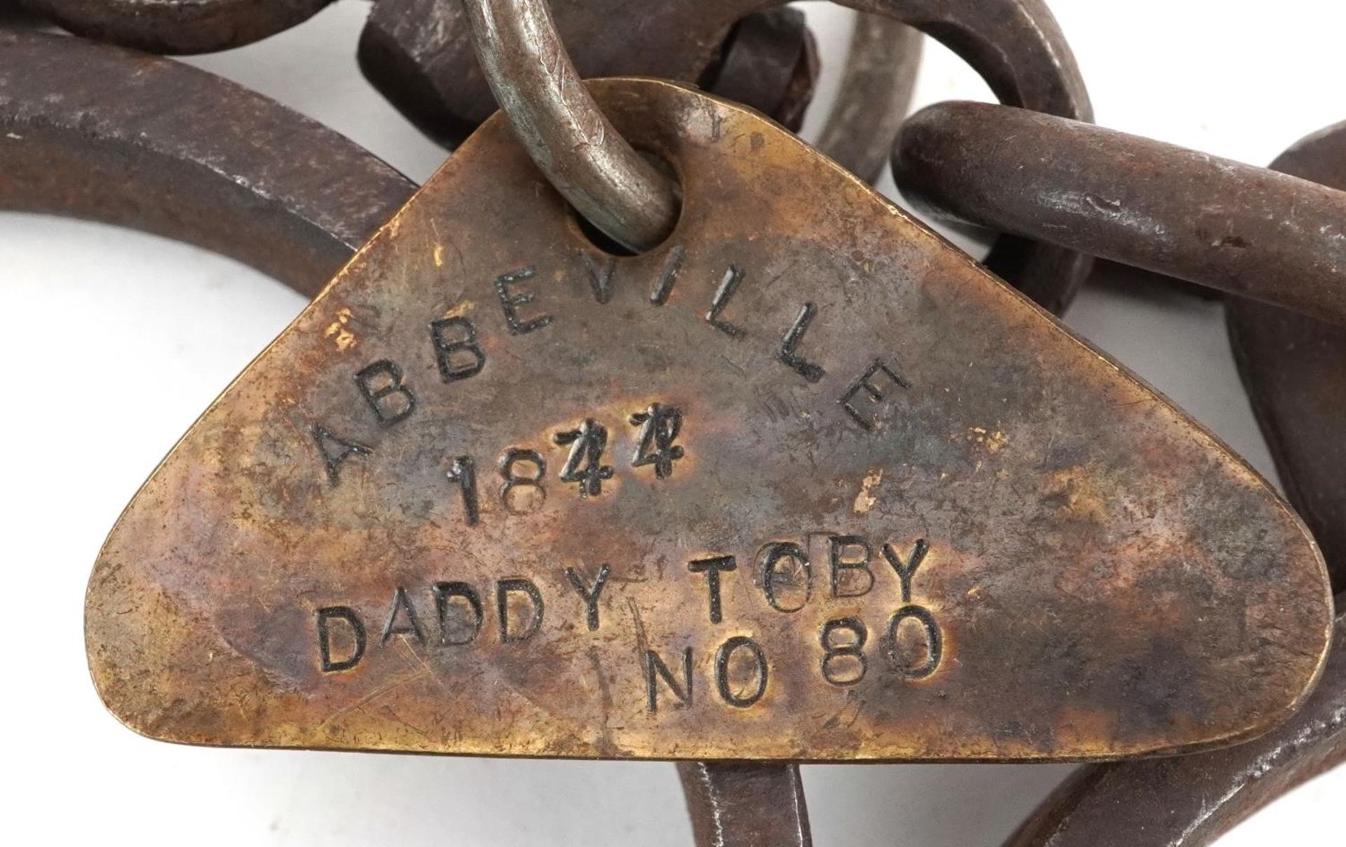 Two pairs of 19th century cast iron handcuffs with tags engraved Abbeville 1844 Daddy Toby no 88 and - Image 3 of 4