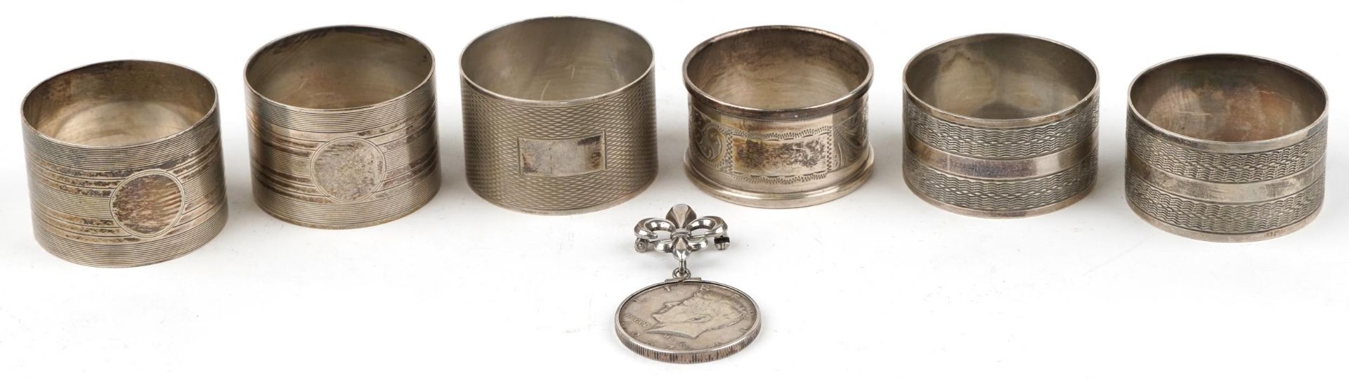 Six George V and later silver napkin rings including two pairs and a 1967 United States of America