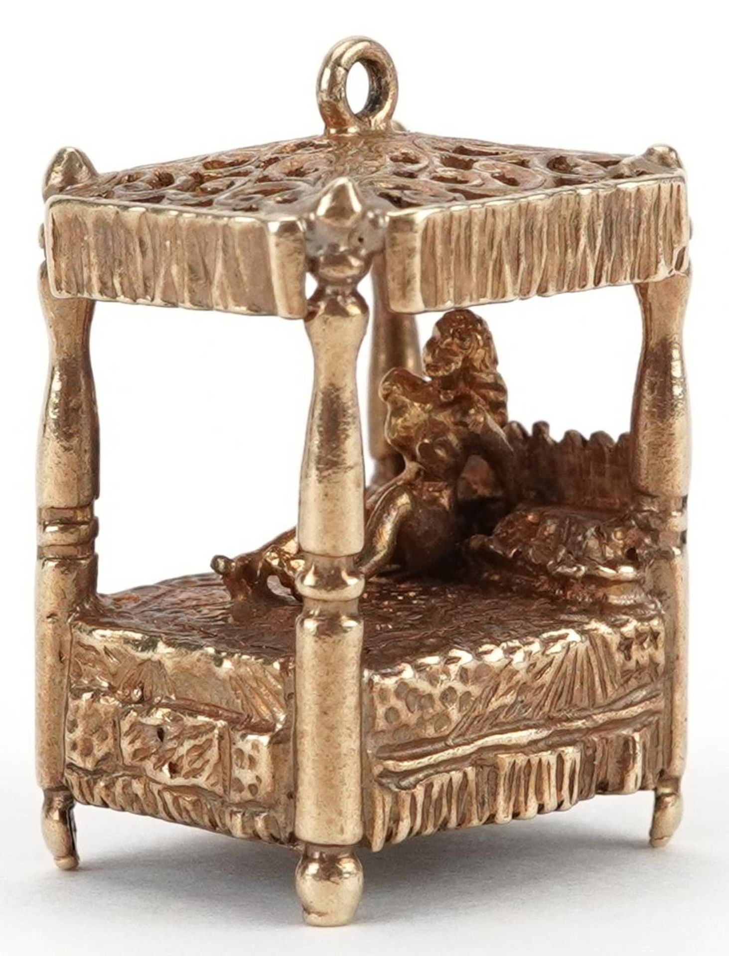 Large 9ct gold charm in the form of a nude female on a four poster bed, 2.4cm high, 12.2g
