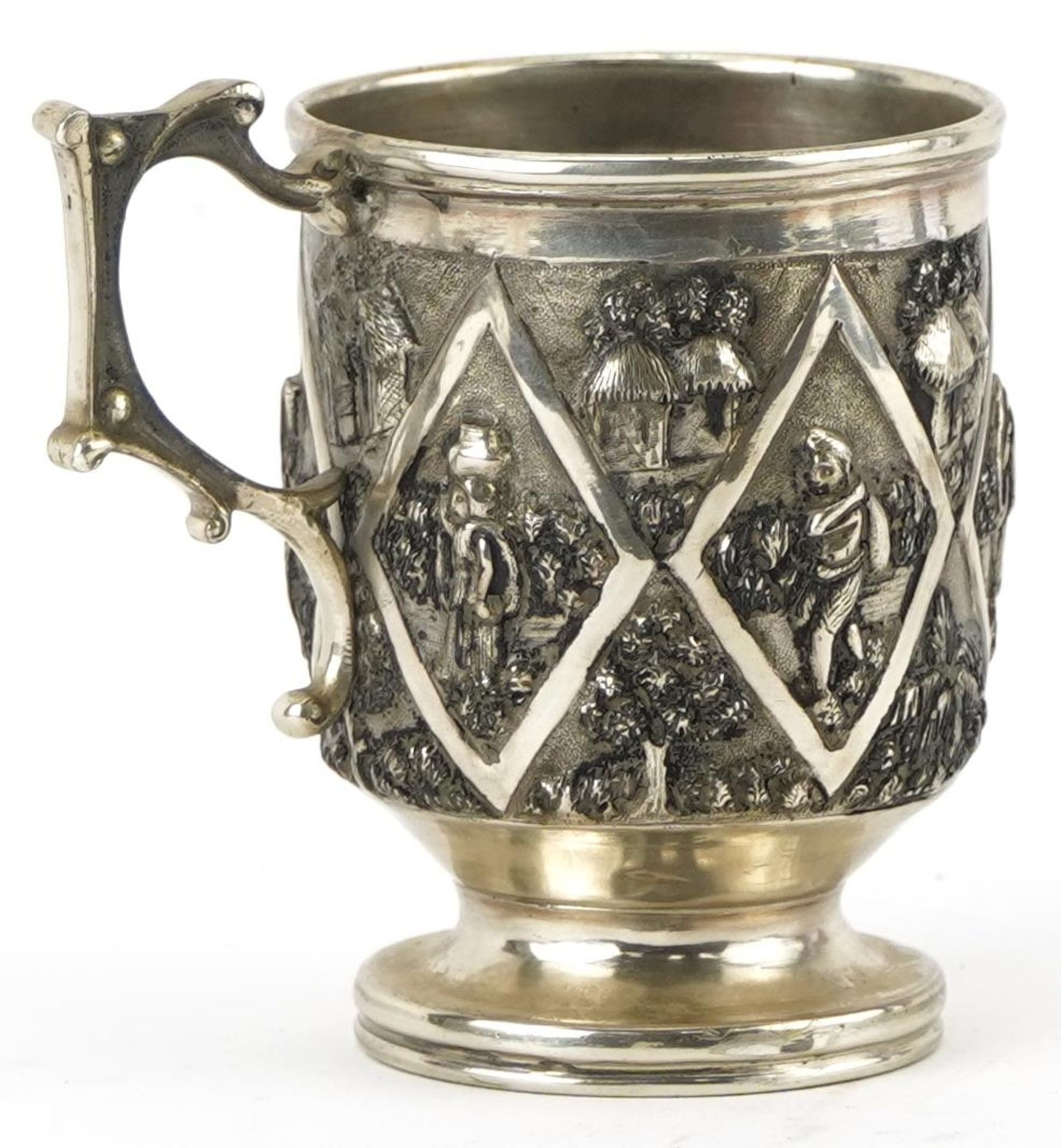 Grish Chunder of Calcutta, Indian unmarked silver christening tankard embossed with villagers and - Image 2 of 4