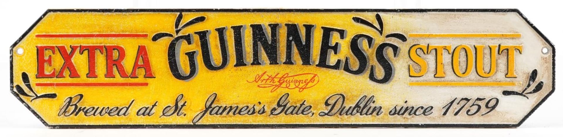 Guinness Extra Stout painted cast iron advertising wall plaque, 56.5cm x 12.5cm