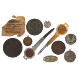 Coins and medallions including two Penny-Farthing folding pocket knives and an Earls Court