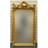 Large ornate gilt framed mirror having bevelled glass mounted with Putti musicians and swags, 62cm x