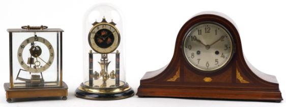 Three clocks comprising a Napoleon hat shaped inlaid mahogany mantle, Kundo electronic and German