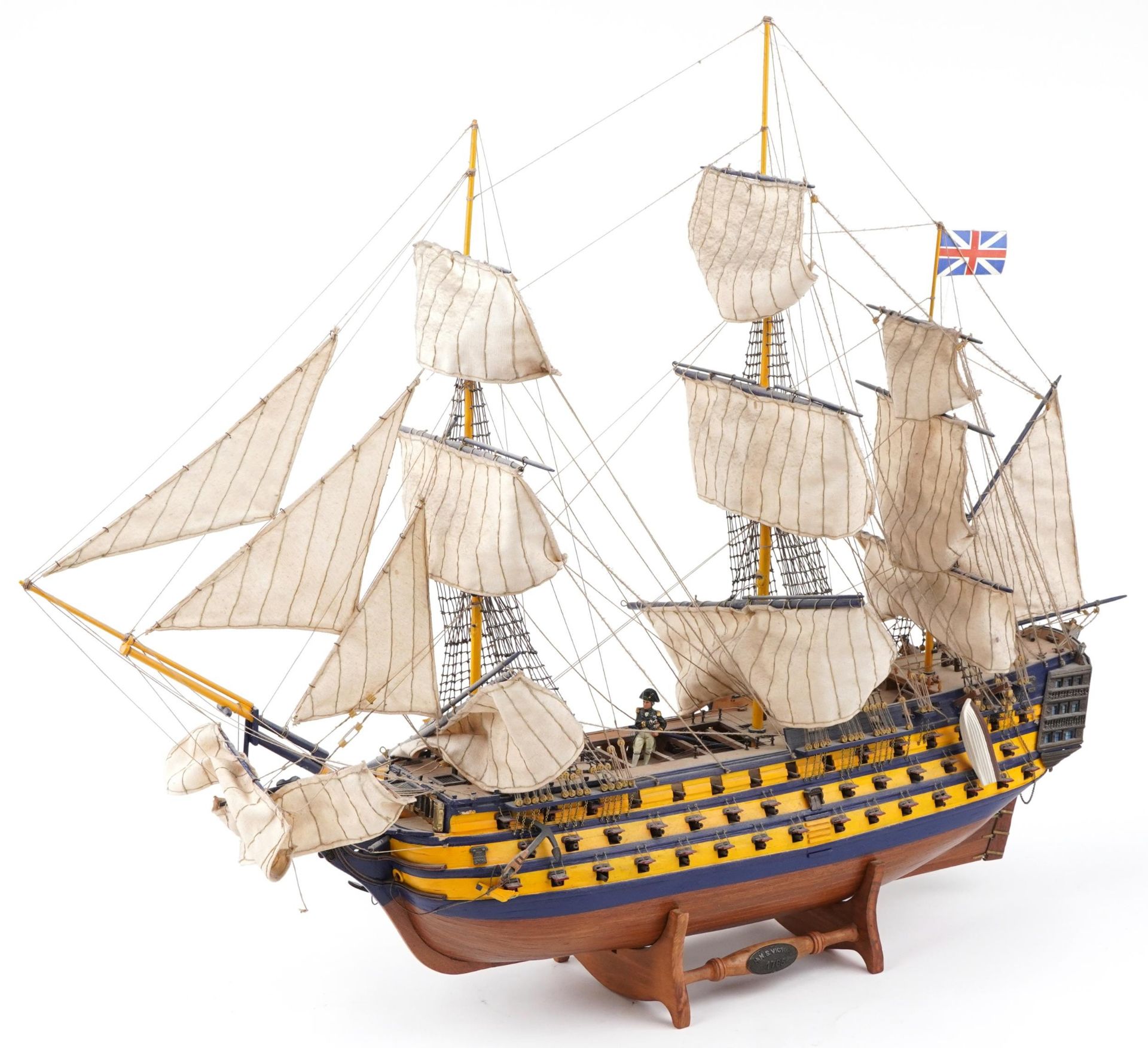 Large hand painted wooden model of HMS Victory on stand together with a Del Prado figure of Vice