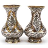 Pair of Islamic brass vases with silver foliate inlay, each 10cm high