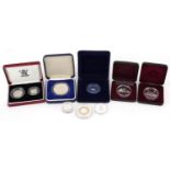 Nine silver proof coins, some with cases, including 1990 silver proof five pence two coins set,