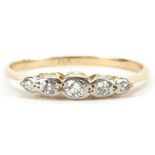 18ct gold and platinum graduated diamond five stone ring housed in an R C Fish Eastham jeweller's