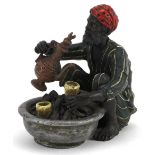 Austrian style cold painted bronze model of an Arab making coffee, 9.5cm in length