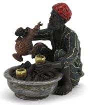 Austrian style cold painted bronze model of an Arab making coffee, 9.5cm in length