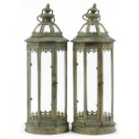 Pair of bronzed hanging lanterns with glass panels, 59cm high