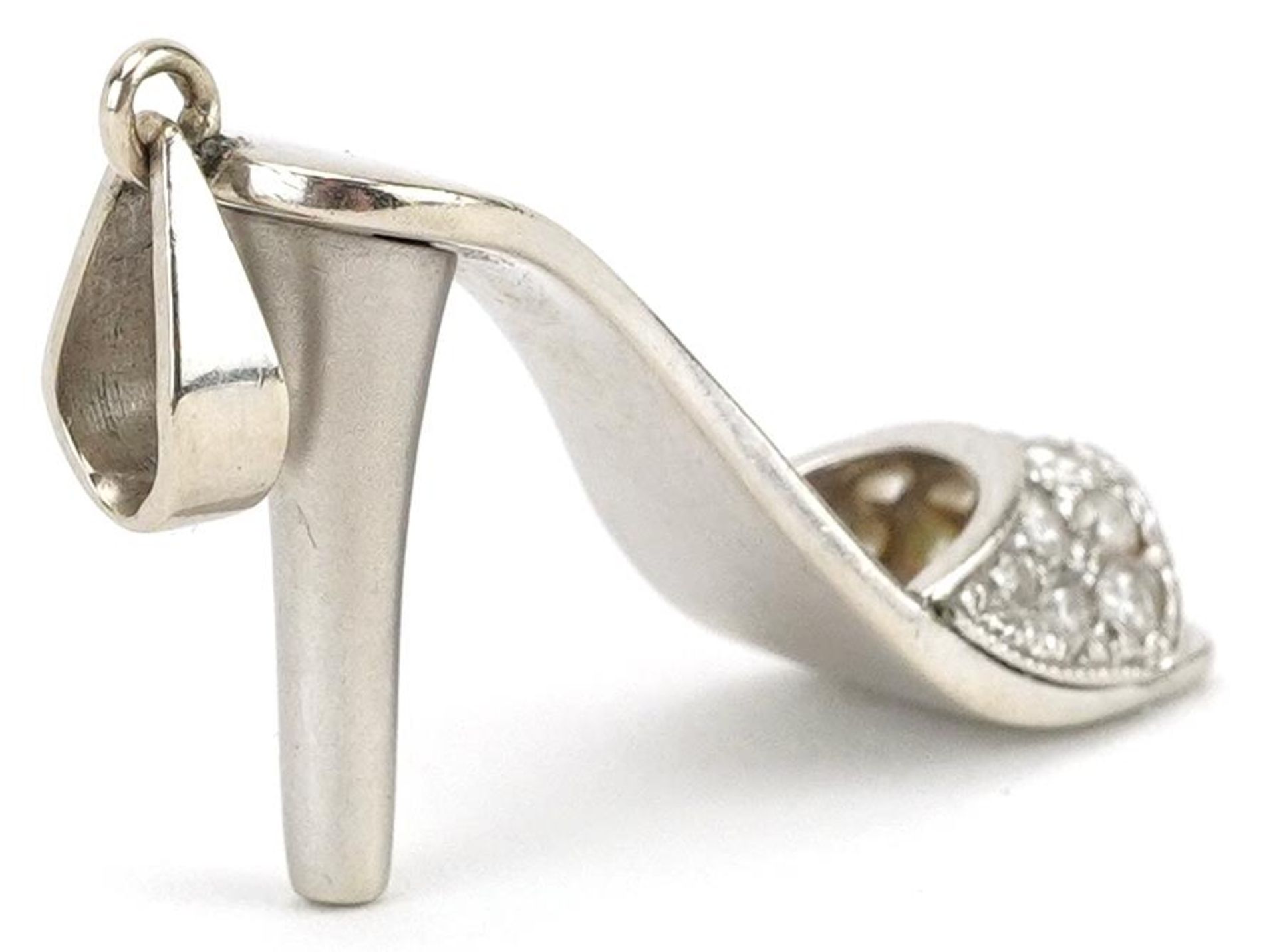 Unmarked white gold diamond charm in the form of a high heeled shoe, tests as 18ct gold, 3.5cm in - Image 2 of 2
