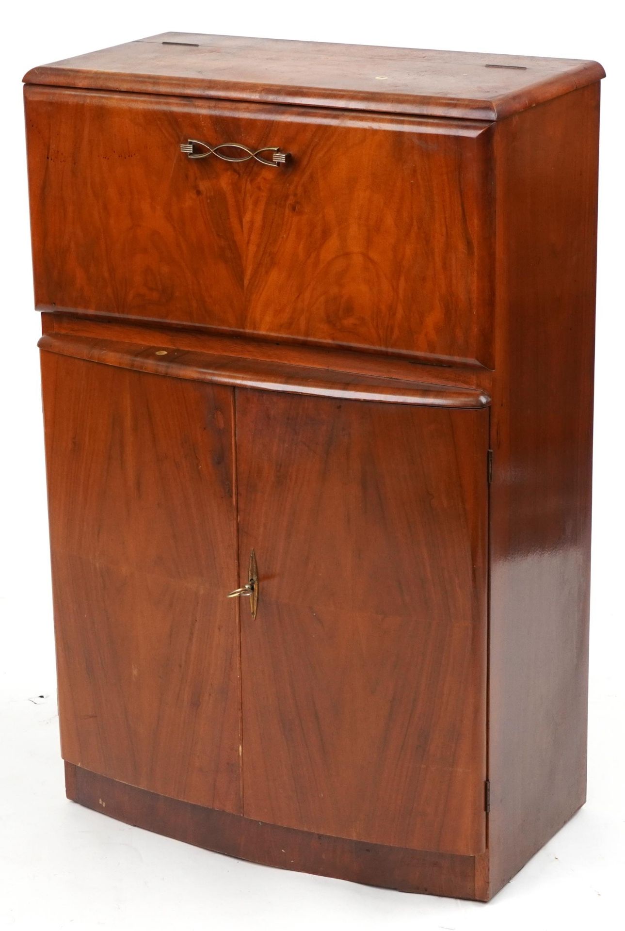 Art Deco walnut cocktail cabinet fitted with a fall enclosing a mirrored interior above a cupboard
