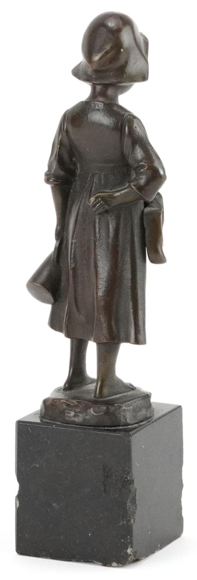 19th century patinated bronze statuette of a young girl holding a jug and pair of clogs raised on - Image 2 of 3
