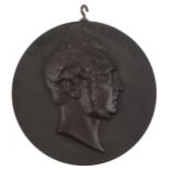 19th century bois durci plaque decorated in relief with a portrait of Viscount Palmerston, 11.5cm in