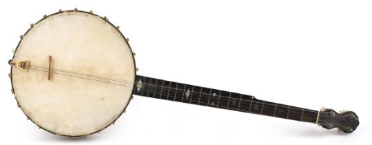 A C Fairbanks & Co mahogany and rosewood four string banjo with mother of pearl inlay, 88cm in