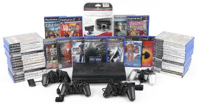 Sony PlayStation 3 games console with a collection of PlayStation 2 games and four PlayStation 1
