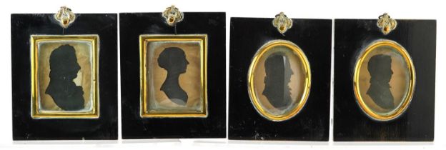 Four Georgian hand painted silhouette portrait miniatures housed in ebonised framed with brass